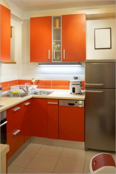 kitchen-idea-cute-small-white-kitchen-design-with-orange-cabinet-large-chrome-refrigerator-and-white-kettle-on-white-countertops-wonderful-kitchen-design-ideas-for-small-spaces-design-634x949